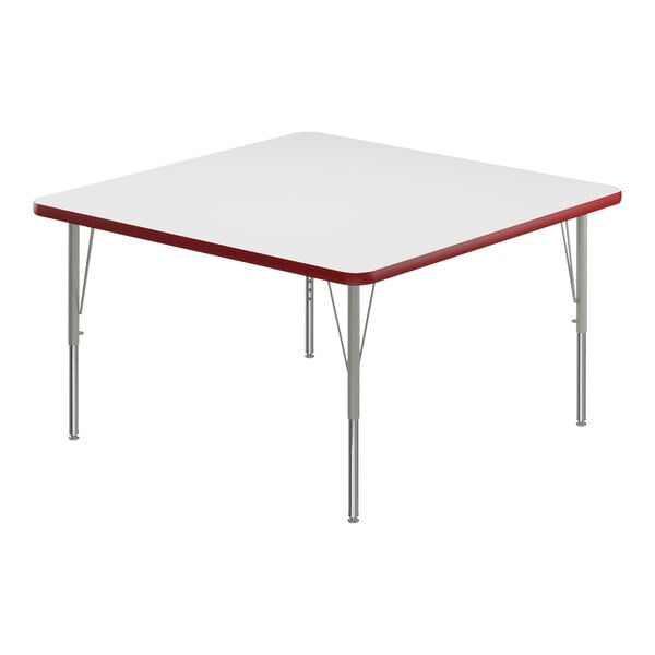 A white square Correll activity table with silver legs and a red edge.
