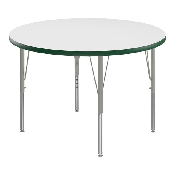 A Correll white round activity table with green and silver legs.