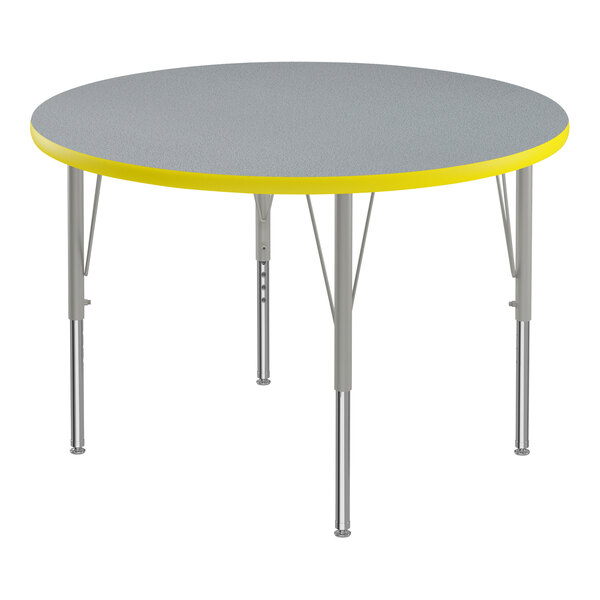 A Correll round activity table with a gray and yellow thermal-fused laminate top.