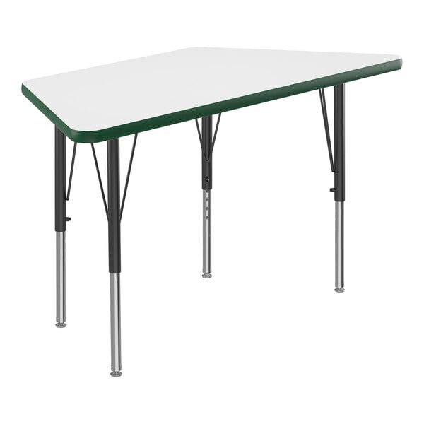 A white trapezoid activity table with green T-mold on the edge and black metal legs.