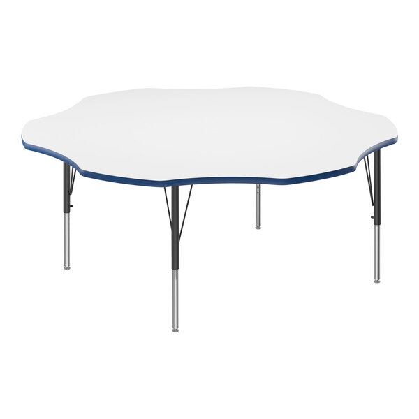 A white Correll activity table with a blue flower-shaped edge.