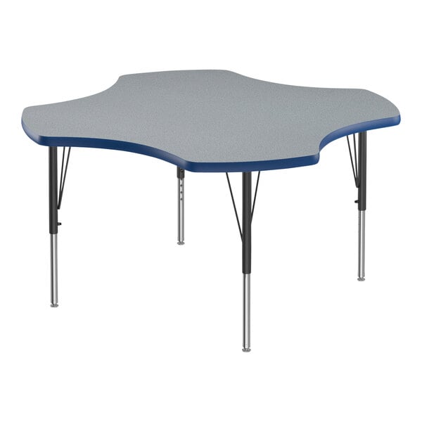 A gray and blue clover-shaped Correll activity table with black legs and blue trim.