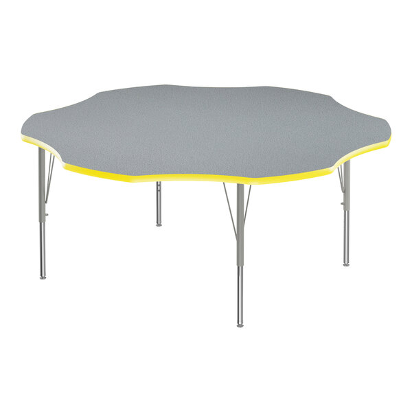 A Correll gray and yellow table with a flower design on the top.