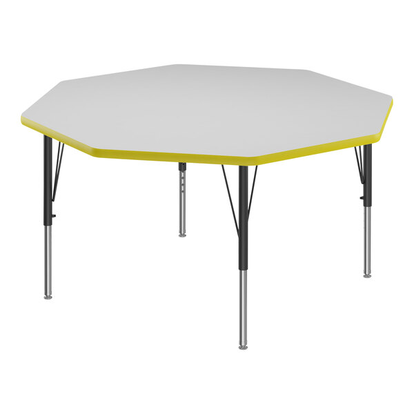 A white and yellow Correll octagon activity table top with yellow T-mold.