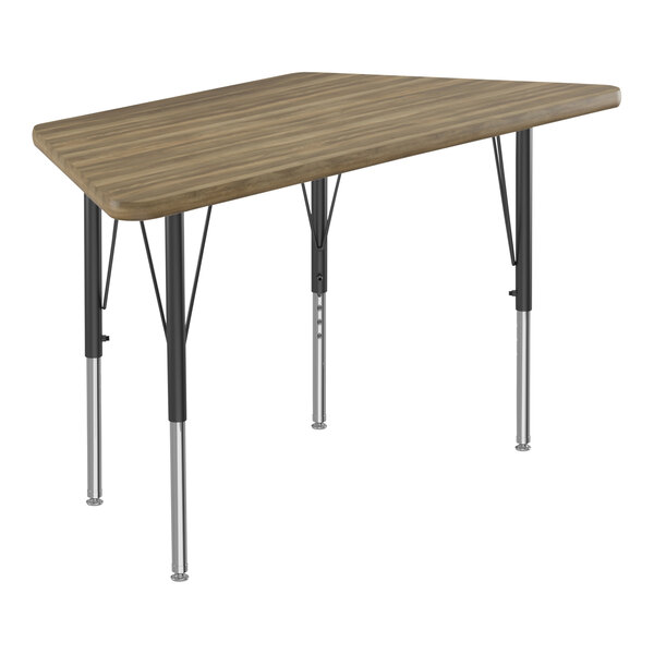 A trapezoid-shaped Correll activity table with black legs and a hickory wood top.