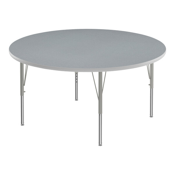 A Correll round activity table with a gray top and metal legs.