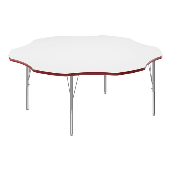 A white Correll activity table with a red flower-shaped edge.