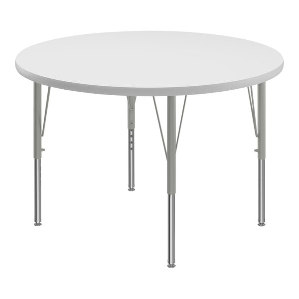 A white round Correll activity table with silver metal legs.