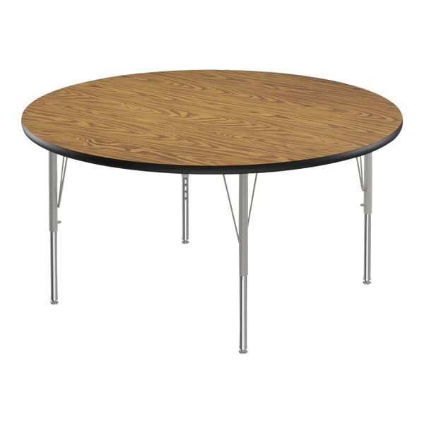 A Correll round activity table with metal legs and a wooden top.