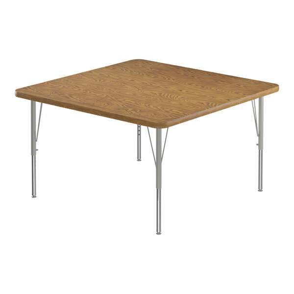 A square medium oak table with silver legs and medium oak trim.