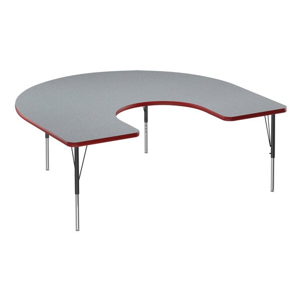 A grey Correll horseshoe activity table with black legs and red trim.