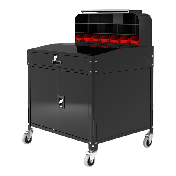 A black steel Luxor locking cabinet for a workstation.