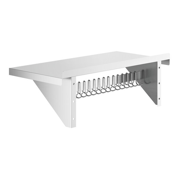 A white shelf with a stainless steel rack holding silver hooks.