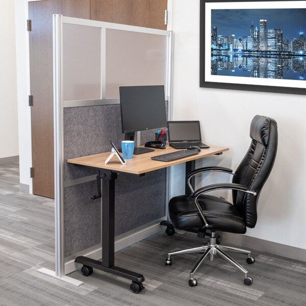 A Luxor modular wall room divider in a room with a desk, chair, and computer.