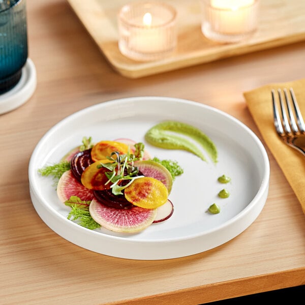 A white Acopa Lore porcelain plate with a slice of radish on it.