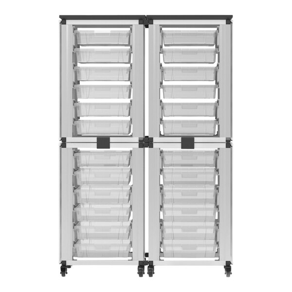 A white plastic drawer with black handles inside a black and white Luxor storage unit.