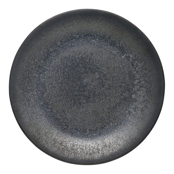 A close-up of a black matte porcelain deep coupe plate with a silver rim.