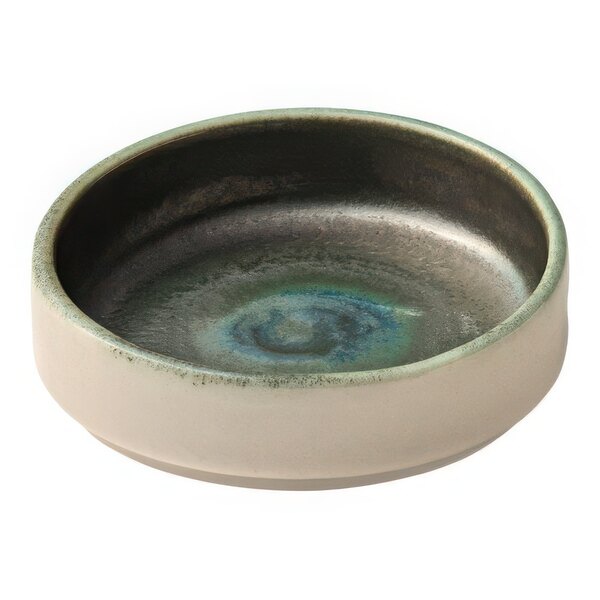 A Heart & Soul avocado porcelain bowl with a green rim.