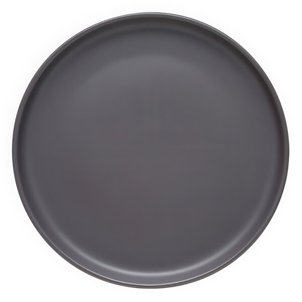 A grey plate with a white circle on a white background.
