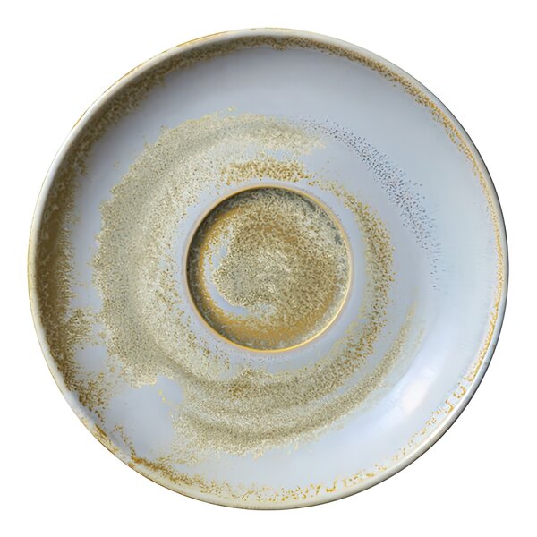 A close-up of a white and gold Heart & Soul Breeze porcelain saucer with a small hole in it.