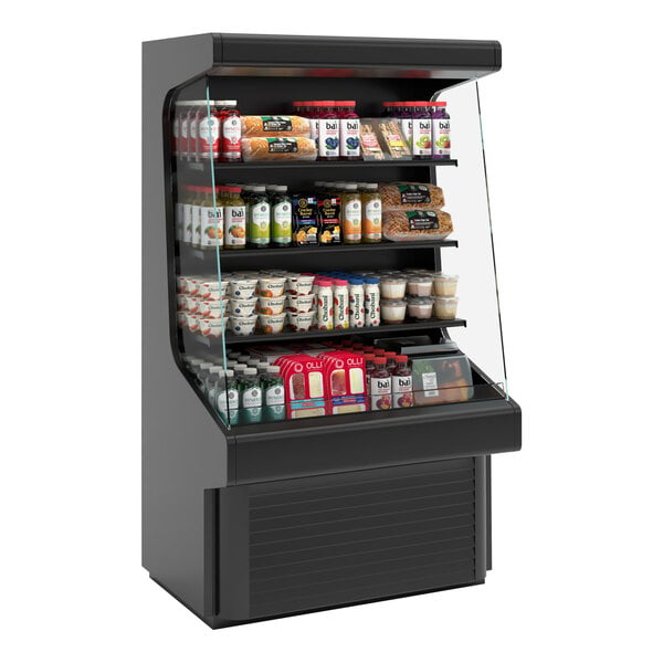 A black vertical open air curtain merchandiser with food and drinks on shelves.