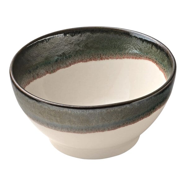 A white porcelain Heart & Soul bowl with a black and white rim and brown and green stripes.