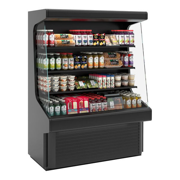 A black vertical open air curtain merchandiser with food on shelves.