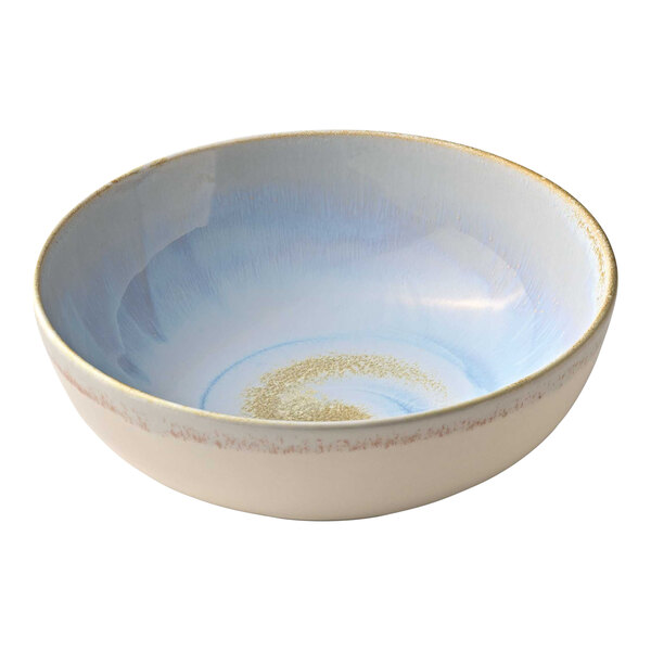 A white Heart & Soul porcelain serving bowl with blue and gold specks on the rim.