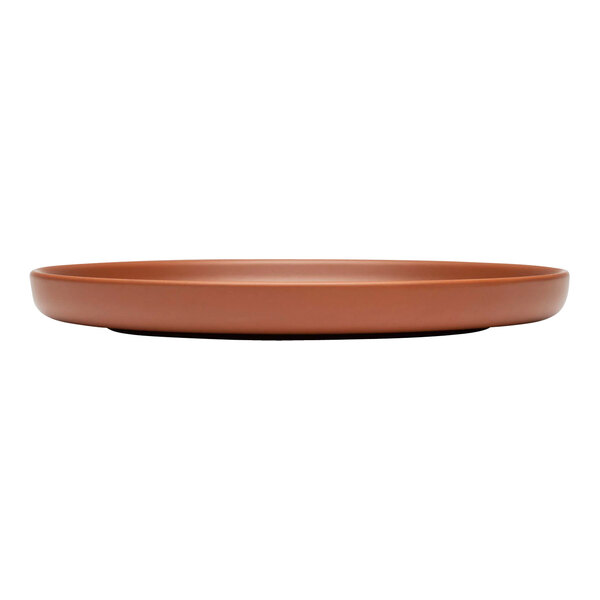 A brown Libbey Driftstone porcelain coupe plate with a matte finish and no rim.