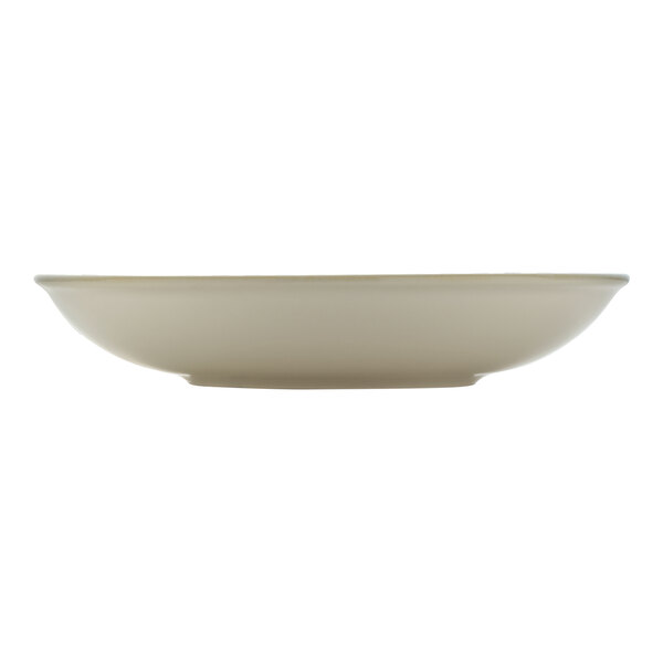 A white porcelain deep coupe plate with a cumin rim.