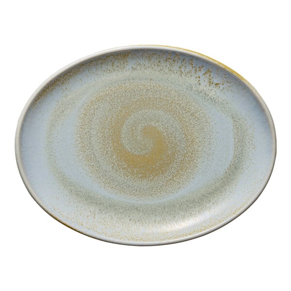 A white porcelain oval platter with a swirl design on the edges.