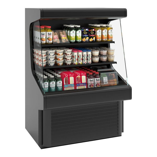 A black vertical open air curtain merchandiser with different types of food on shelves.