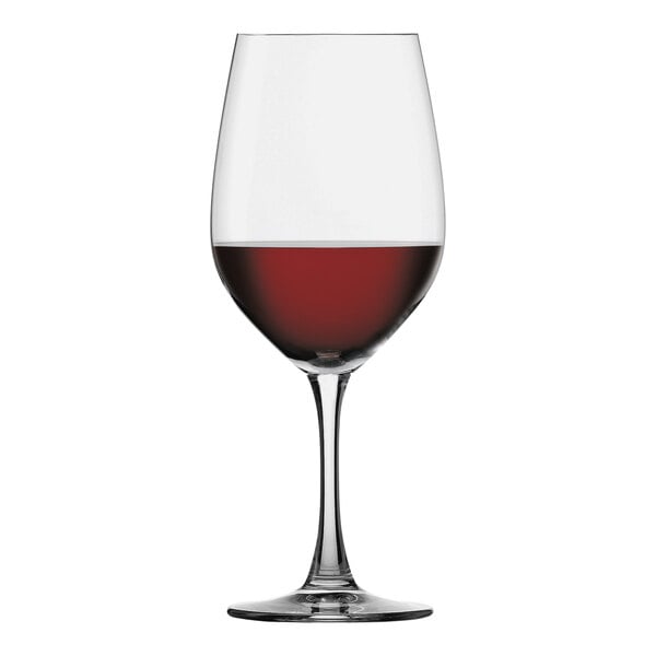 A Spiegelau Bordeaux wine glass filled with red wine.