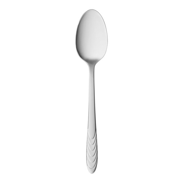 A long stainless steel spoon with a white handle.