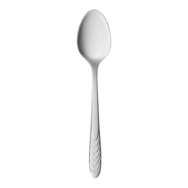 A Reserve by Libbey stainless steel demitasse spoon with a white handle on a white background.