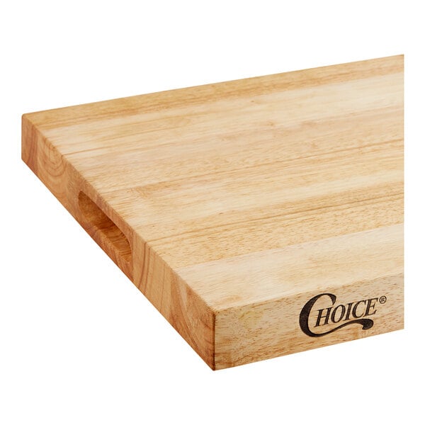 A Choice wood cutting board with squared edges on a table in a home kitchen.