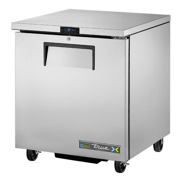 A silver True undercounter refrigerator / freezer on wheels.