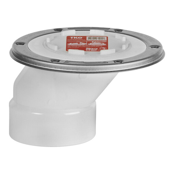 A white plastic drain pipe with a silver circle and a red Sioux Chief lid.