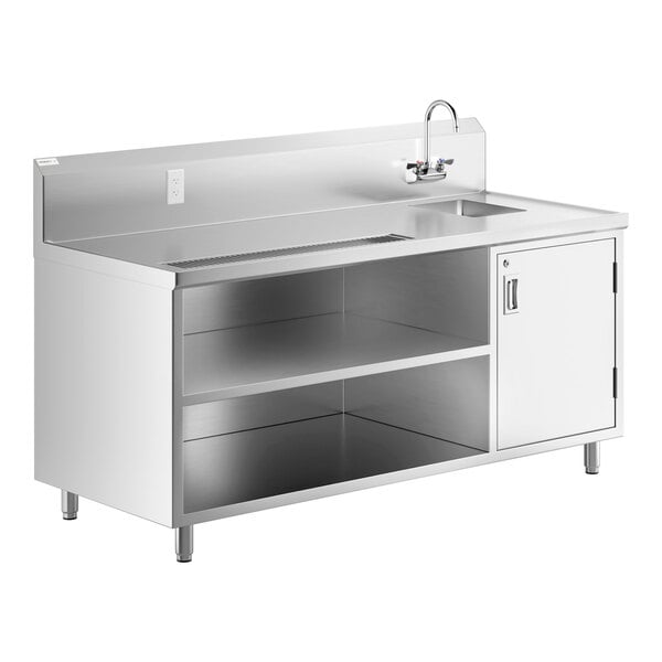 A stainless steel Regency beverage table with sink and faucet.