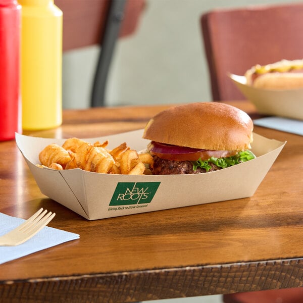 A rectangular compostable bamboo food tray holding a burger and curly fries.