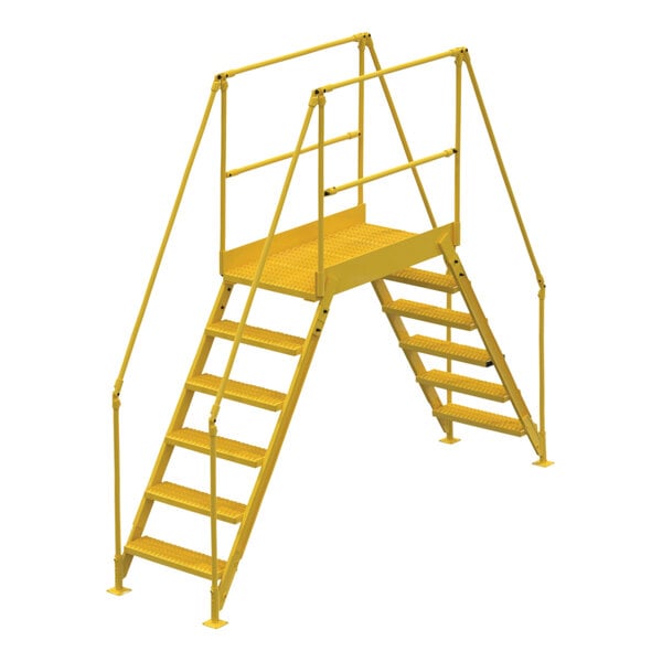 A yellow metal Vestil crossover ladder with handrails.