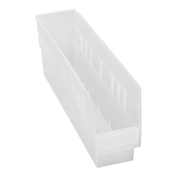 A clear plastic Quantum shelf bin with two compartments.