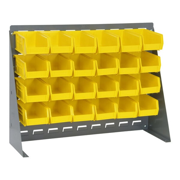 A Quantum gray steel bench rack with yellow bins on it.