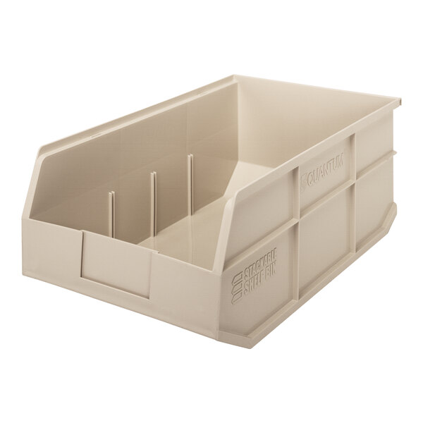 An ivory plastic shelf bin with two compartments.