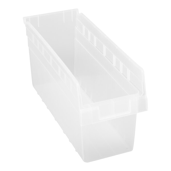 A close-up of a clear plastic Quantum shelf bin.