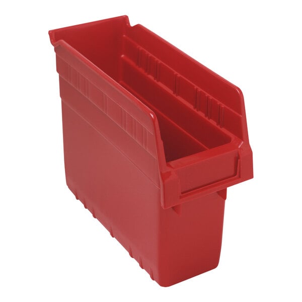 A red plastic Quantum shelf bin with two compartments.