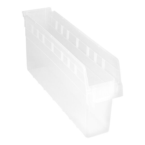 A close-up of a clear plastic Quantum shelf bin with three compartments.