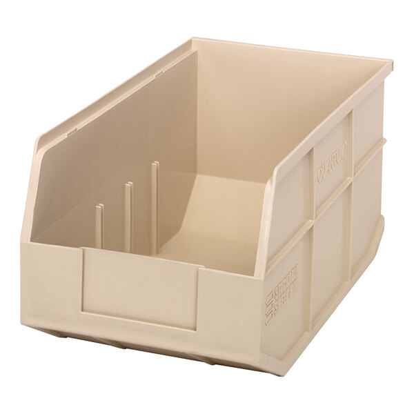 An ivory plastic Quantum stackable shelf bin with two compartments.