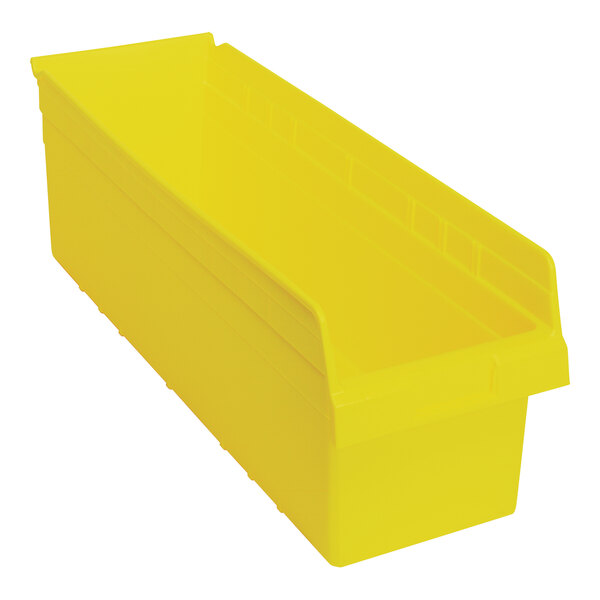 A yellow plastic Quantum shelf bin with two compartments.