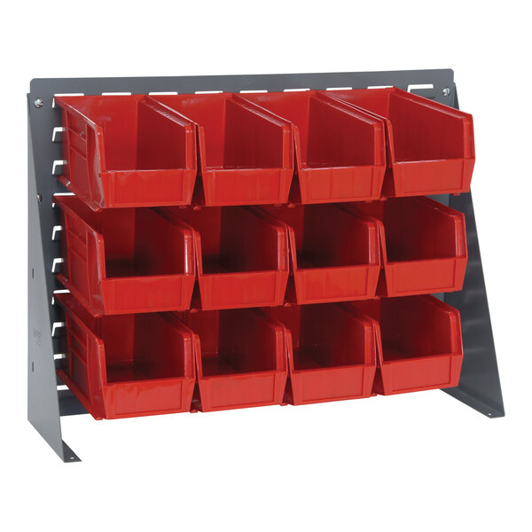 A Quantum gray steel bench rack with red bins attached to it.